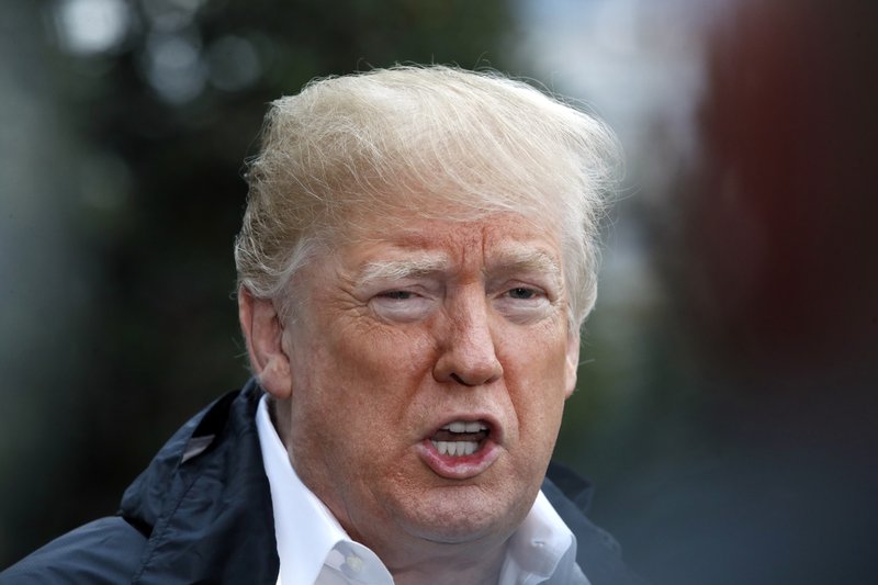 President Donald Trump answers a question from a member of the media as he leaves the White House, Saturday Nov. 17, 2018, in Washington, en route to see fire damage in California. (AP Photo/Jacquelyn Martin)