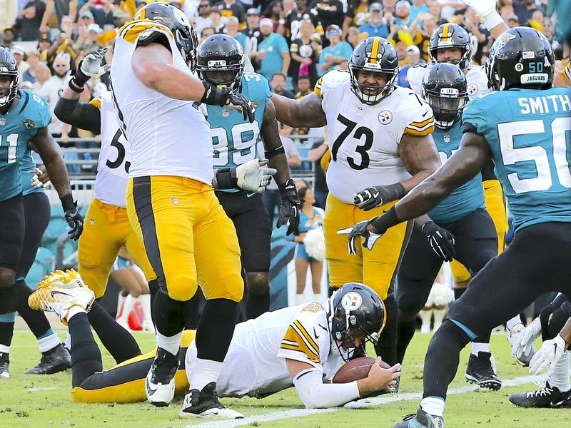 The Associated Press SIX STRAIGHT: Pittsburgh quarterback Ben Roethlisberger dives over the goal line Sunday for the go-ahead touchdown in front of Jaguars outside linebacker Telvin Smith (50) during the final seconds of the Steelers' 20-16 win in Jacksonville, Fla.