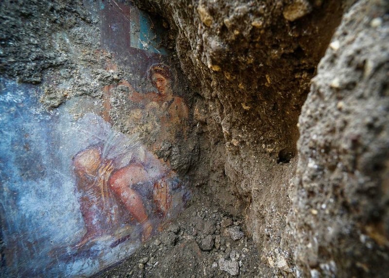 CORRECTS TITLE OF THE FIGURE SHOWN IN THE FRESCO, FROM GODDESS TO QUEEN OF SPARTA - The fresco "Leda e il cigno" (Leda and the swan) discovered last Friday in the Regio V archeological area in Pompeii, near Naples, Italy, is seen Monday, Nov. 19, 2018. The fresco depicts a story and art subject of Greek mythology, with Queen of Sparta Leda being impregnated by Zeus - Jupiter in Roman mythology - in the form of a swan. (Cesare Abbate/ANSA via AP)