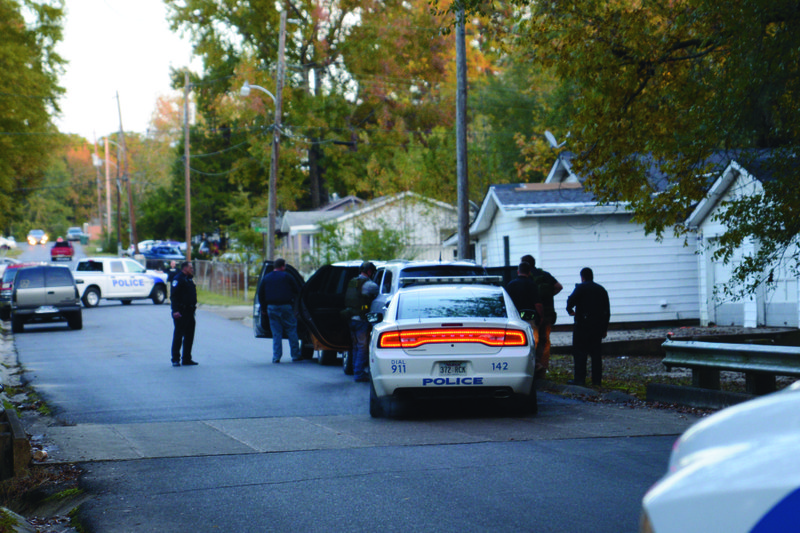 Magnolia Police and its tactical and K-9 units search for a local homicide suspect Monday evening near the corner of Norma and Gladys Streets in Magnolia.