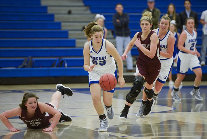 NWA Democrat-Gazette/CHARLIE KAIJO Rogers High School guard Kate McConnell (23) makes a steal during a basketball game, Monday, November 19, 2018 at Rogers High School in Rogers.