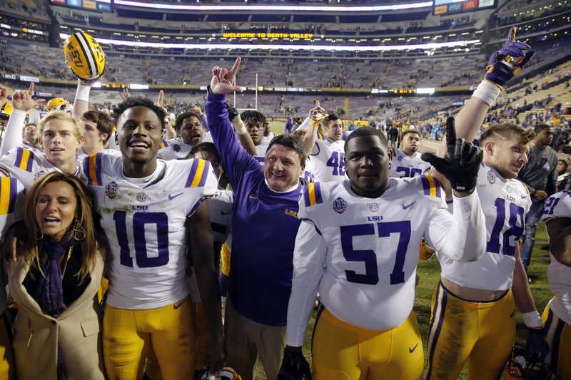 LSU coach Ed Orgeron sings the school alma mater with his team after an NCAA college football game against Rice in Baton Rouge, La., Saturday, Nov. 17, 2018. LSU won 42-10. (AP Photo/Gerald Herbert)