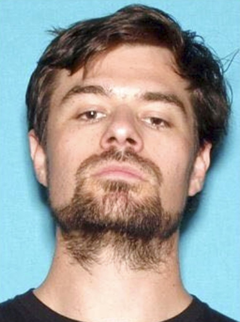 FILE - This 2017 file photo from the California Department of Motor Vehicles shows Ian David Long. Authorities said the Marine combat veteran opened fire Wednesday evening, Nov. 7, 2018, at a country music bar in Southern California. If authorities have concluded why Long shot and killed 12 people at the bar, they aren't sharing, and his family isn't talking, either. (California Department of Motor Vehicles via AP, File)