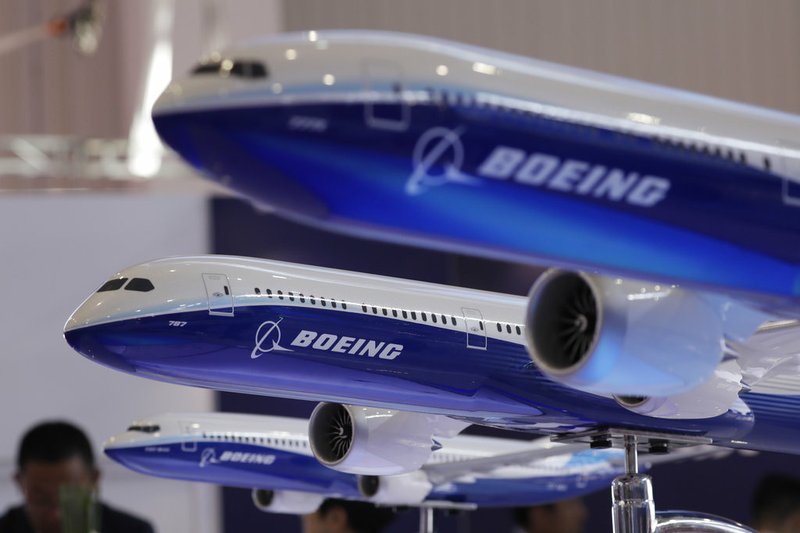 FILE- In this Nov. 6, 2018, file photo models of a Boeing passenger airliner are displayed during the 12th China International Aviation and Aerospace Exhibition, also known as Airshow China 2018, in Zhuhai city, south China's Guangdong province. Boeing Co. canceled a conference call that it scheduled for Tuesday, Nov. 20, with airlines to discuss issues swirling around its newest plane, which has come under close scrutiny after a deadly crash in Indonesia. (AP Photo/Kin Cheung, File)