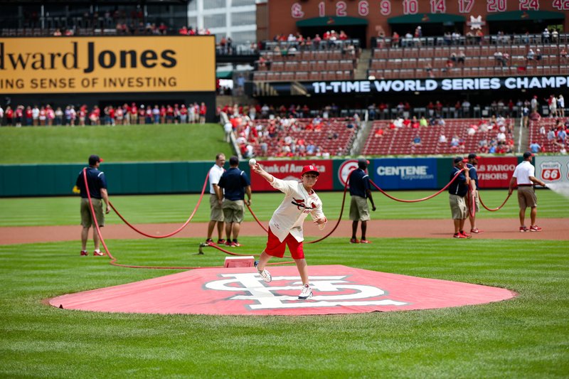 Submitted photo FIRST PITCH: Kevin Dean Jr., the great-grandson of Paul "Daffy" Dean and great-great-nephew of Dizzy Dean, throws out the first pitch for the St. Louis Cardinals at Busch Stadium on Aug. 19 for Dizzy Dean Watch Promo Day.