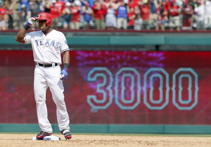 In this July 30, 2017, file photo, Texas Rangers' Adrian Beltre tips his helmet as he acknowledges cheers after hitting a double for his 3,000th career hit, that came off a pitch from Baltimore Orioles' Wade Miley in the fourth inning of a baseball game, in Arlington, Texas.  (AP Photo/Tony Gutierrez, File)