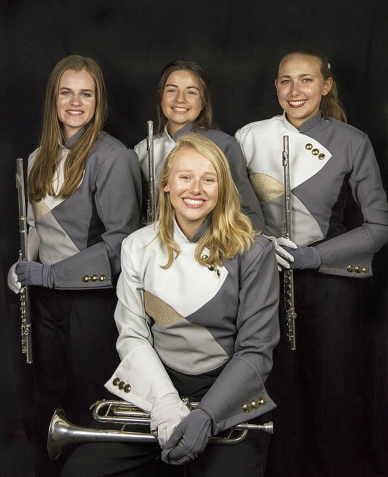 Courtesy Photo/BENTONVILLE PRIDE MARCHING BAND Four members of the Bentonville High School's Pride Marching Band will be performing Thursday with the Macy's Great American Marching Band during the Macy's Thanksgiving Day Parade on Thursday in New York City. They include Kayton Little (front), and Ariel Trimble (from left), Samantha Petch and Allie Abide. Also performing will be West High School's Dylan Engholm (not pictured).