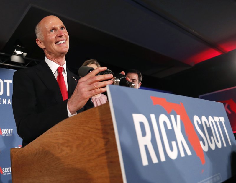  In this Nov. 7, 2018 file photo, Gov. Rick Scott smiles as he speaks to supporters at an election watch party in Naples, Fla. Trump-allied Republican Ron DeSantis was formally elected governor of Florida and outgoing Gov. Rick Scott elected U.S. Senator on Tuesday, Nov. 20, 2018, when the state certified election results two weeks after tight margins prompted tumultuous recounts. (AP Photo/Wilfredo Lee, file)