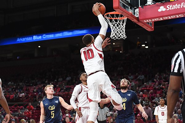 Arkansas center Daniel Gafford (10) goes in for a dunk during a game against Montana State on Wednesday, Nov. 18, 2018, in Fayetteville. 