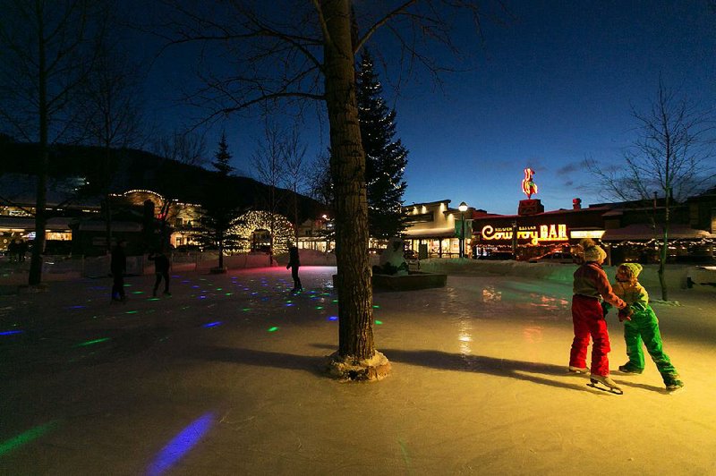 Skaters in Jackson, Wyo., take to an outdoor ice rink, bathed in the neon glow of the Million Dollar Cowboy Bar. 