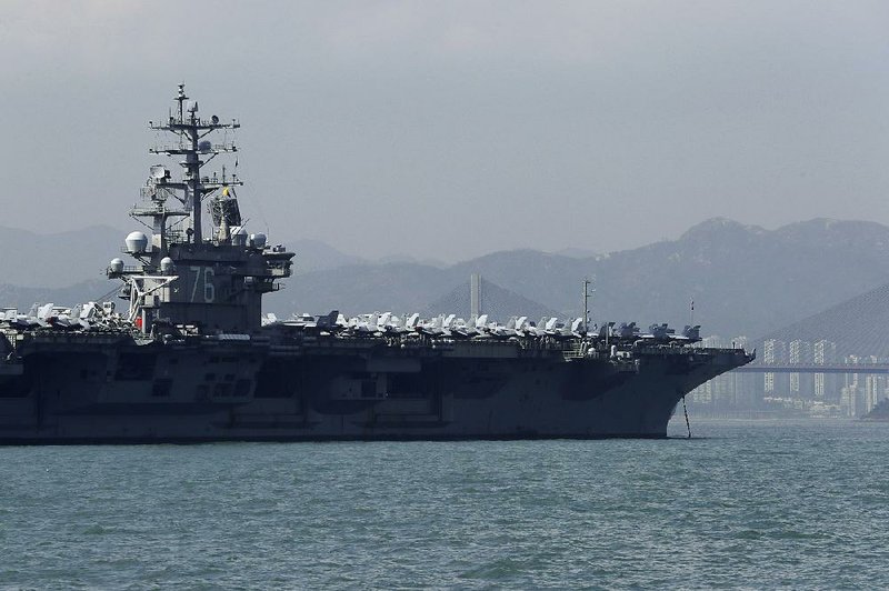The USS Ronald Reagan sits at anchor Wednesday in the port of Hong Kong. 