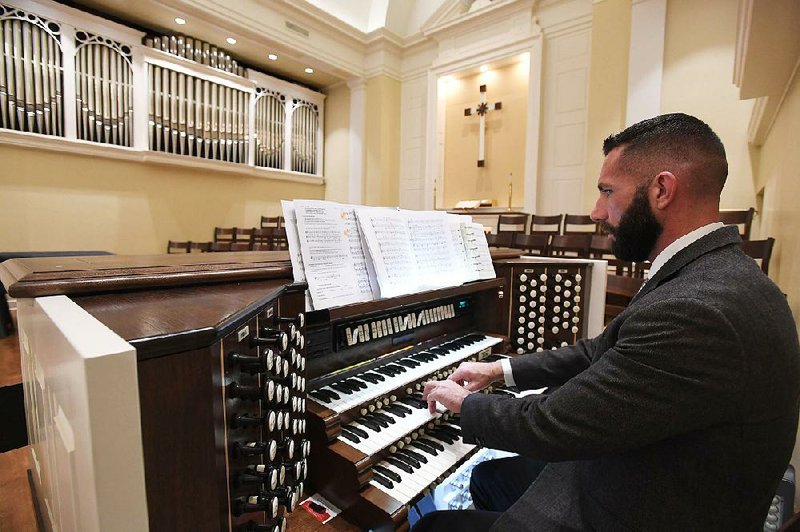Scott Montgomery plays a pipe organ Sunday at Central United Methodist Church in downtown Fayetteville. 
