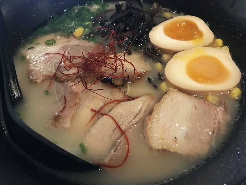 Cha-Siu Ramen features pork broth, sliced pork belly, soft boiled egg, green onion, black mushrooms, seaweed and “chili hair” at Little Rock’s Aji Ramen Bar. 