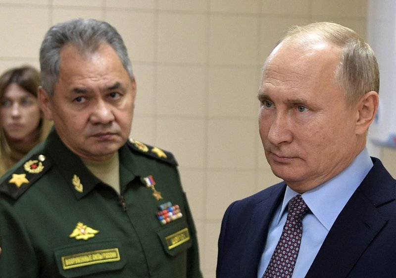 Russian President Vladimir Putin, right, and Defense Minister Sergei Shoigu visit a military technological center in Anapa, Russia, Thursday, Nov. 22, 2018. Putin said the new center would play an important role in developing advanced weapons technologies. (Alexei Nikolsky, Sputnik, Kremlin Pool Photo via AP)