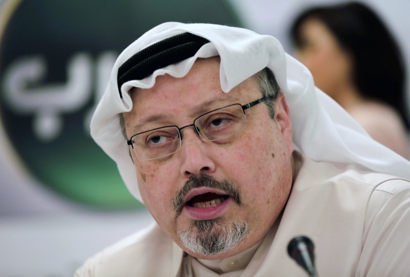 In this Dec. 15, 2014, file photo, Saudi journalist Jamal Khashoggi speaks during a press conference in Manama, Bahrain. President Donald Trump says the U.S. will not levy additional punitive measures at this time against Saudi Arabia over the killing of Jamal Khashoggi. (AP Photo/Hasan Jamali, File)