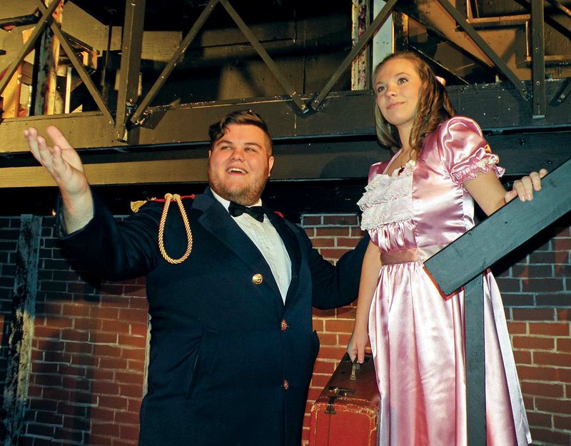 Captain Crewe, played by Matthew Burns, encourages his daughter, Sara, played by Katharine Crowe, about her trip back to London in this rehearsal scene from A Little Princess. Both are veteran actors at The Royal Theatre in Benton. Burns is a senior at Ouachita Baptist University, and Crowe is a sophomore at Benton High School.
