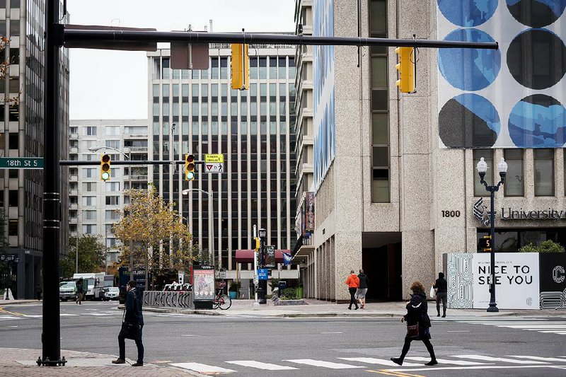 Pedestrians walk in the Crystal City area of Arlington, Virginia, earlier this month. 