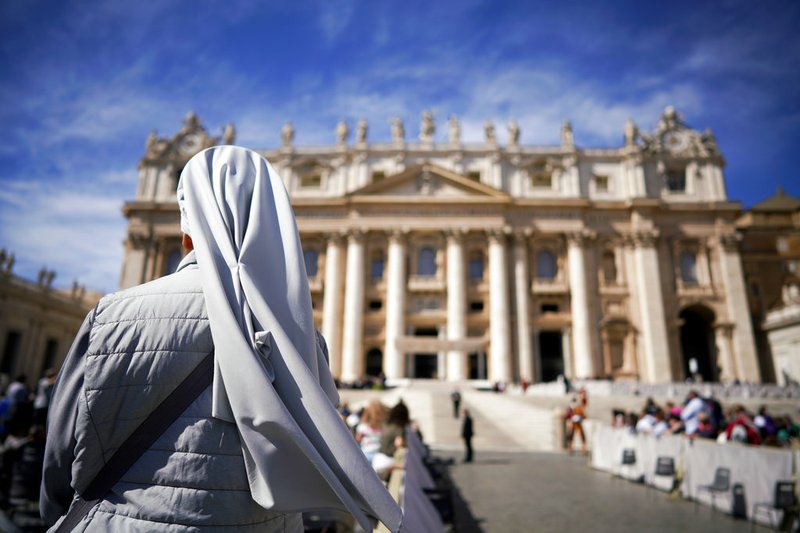  In this Wednesday, Sept. 26, 2018 file photo, a nun waits for the arrival of Pope Francis for his weekly general audience, in St. Peter's Square at the Vatican.