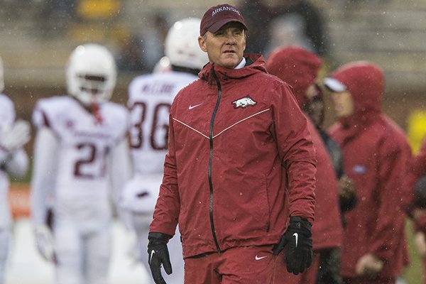 Arkansas coach Chad Morris watches warmups prior to a game against Missouri on Friday, Nov. 23, 2018, in Columbia, Mo.