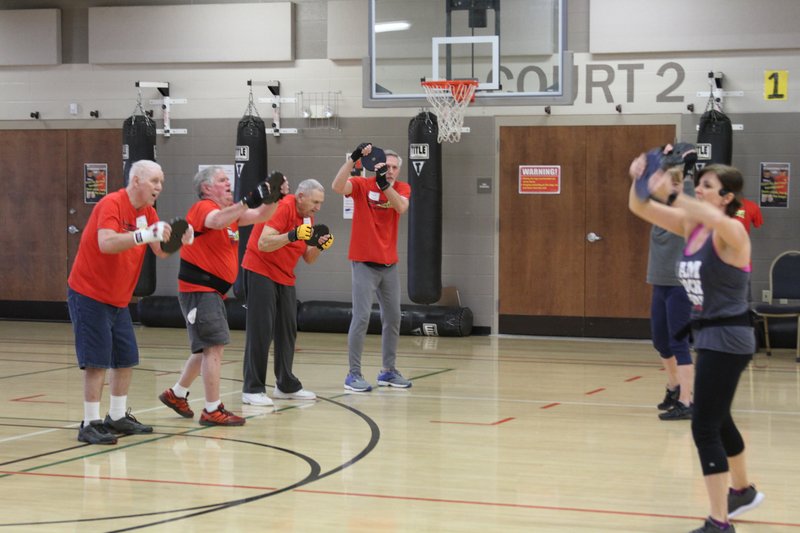 The Sentinel-Record/Tanner Newton
FIGHTING BACK:
FBC Fitness Director Amy Johnson leads a Rock Steady Boxing class at First Baptist Church recently. RSB is a boxing-based workout group for people with Parkinson’s disease.