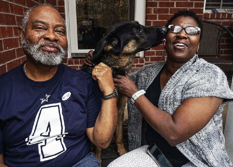 Darryl Lunon and his wife, Barbara, pose with Bibi at their home in Pulaski County on Sunday. The couple’s lawsuit against North Little Rock animal control and Pulaski County is now at the 8th U.S. Circuit Court of Appeals. 