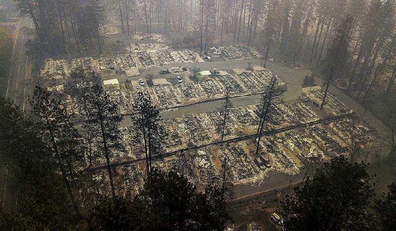 The massive wildfire that killed dozens of people and destroyed thousands of homes has been fully contained after burning for more than two weeks, authorities said Sunday. 