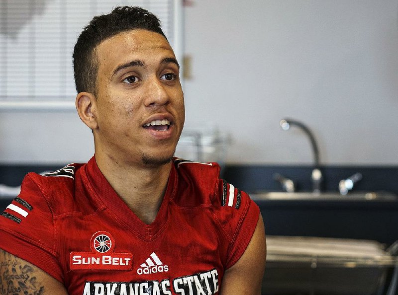 ASU wide reciever Justin McInnis talks to reporters during Arkansas State Media Day at the ASU Football Complex in Joneboro Thursday, August 2, 2018.
