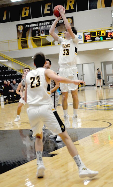 MARK HUMPHREY ENTERPRISE-LEADER Prairie Grove junior Alex Edmiston hit this turnaround jumper to give the Tigers a 10-point lead in the third quarter. Prairie Grove went ice cold down the stretch losing 43-38 to Siloam Springs on Tuesday, Nov. 20.