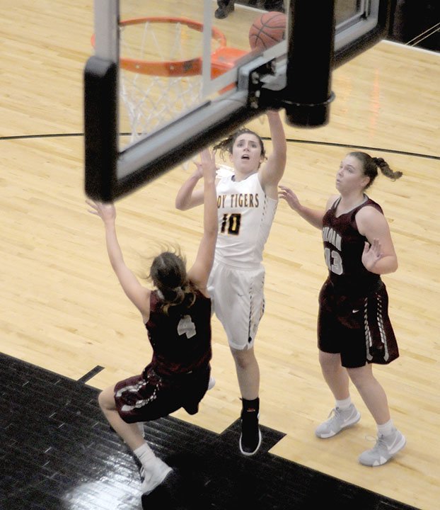 MARK HUMPHREY ENTERPRISE-LEADER Prairie Grove senior Lexie Madewell gets to the basket against Siloam Springs during the Lady Tigers a 10-point win, 50-40, on Tuesday, Nov. 20.