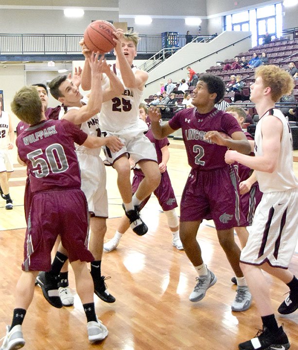 MIKE ECKELS NWA NEWSPAPERS Pioneer Beau Tomblin (No. 25) pulls down a rebound in the mists of a crowd of Lincoln junior Wolves and Pioneers players during the Gentry versus Lincoln JV Wolfpack basketball contest which was part of the Nov. 19 Turkey Shoot Basketball tournament in the gym at Lincoln High School.