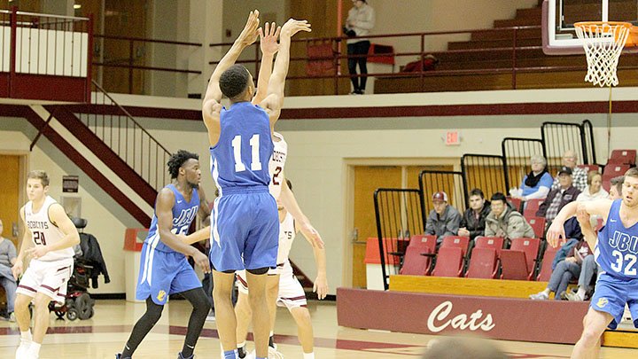 Photo courtesy of College of the Ozarks John Brown frshman guard Desmond Kennedy, No. 11, takes a shot Monday against College of the Ozarks (Mo.) in Point Lookout, Mo.