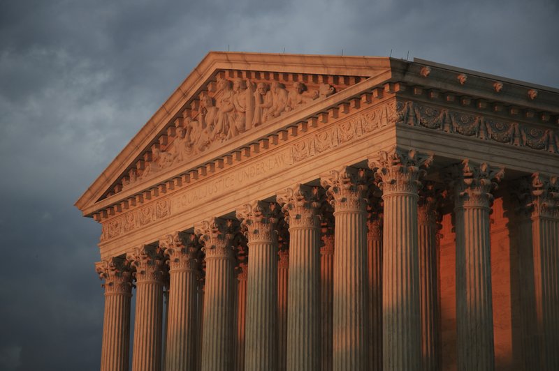 In this Oct. 4, 2018 photo, the U.S. Supreme Court is seen at sunset in Washington.  The Supreme Court is debating whether an Indian tribe retains control over a vast swath of eastern Oklahoma in a case involving a Native American who was sentenced to death for murder. (AP Photo/Manuel Balce Ceneta)