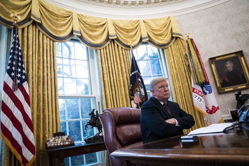 President Donald Trump sits at his desk in the Oval Office during an interview Tuesday with The Washington Post. 