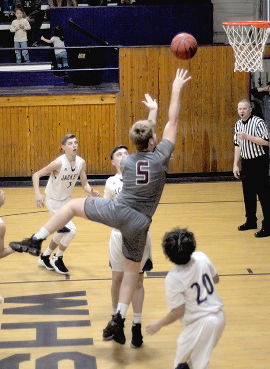 MARK HUMPHREY ENTERPRISE-LEADER Lincoln senior Caleb Hale scores two of his team-high 12 points against Westville on Nov. 16, 2018. The Wolves lost the non-conference season-opener, 53-34.