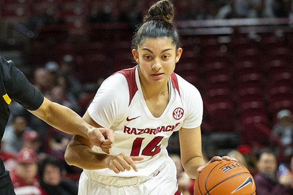 Arkansas guard Jailyn Mason dribbles past an Arizona State defender during a game Sunday, Nov. 18, 2018, in Fayetteville.