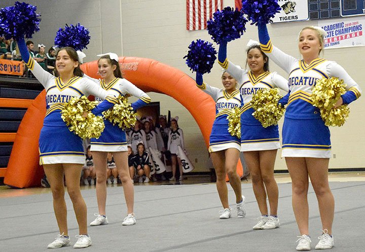 Members of the Decatur cheer team lead the crowd gathered at Heritage High School in a gameday cheer during the 2018 War Eagle Invitational Cheer competition in Rogers Nov. 17. Leading the cheers are Ithzel Martinez (left), Aaliyah Orozco, Desi Meek, Heidi Rubi and Tabby Tilley.