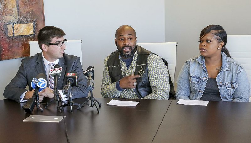 Sitting Wednesday with attorney Solomon Radner (left) of Southfield, Mich., plaintiff Tyrone Jackson talks about the 2017 shooting at the Power Ultra Lounge in downtown Little Rock. At right is plaintiff Tasheara Slocum, who also spoke. 