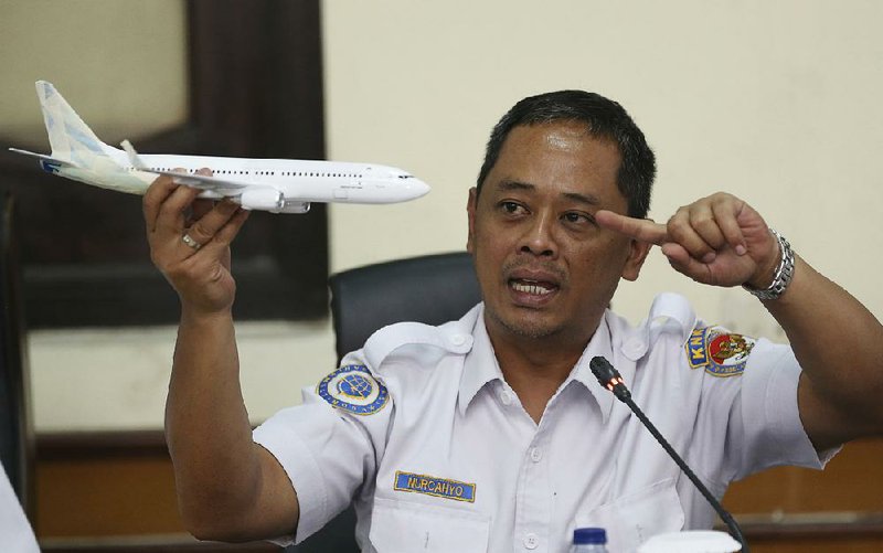 Nurcahyo Utomo of Indonesia’s National Transportation Safety Commission uses a model Boeing 737 Max 8 as he describes what  investigators are trying to determine went wrong and why. 