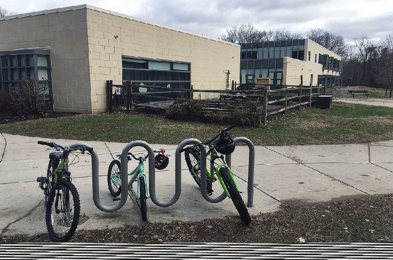 Bicycles sit outside  Tokeneke  Elementary  School  in  Darien,  Conn., where  the school system’s ban on parental  lunch visits  has riled the community. 