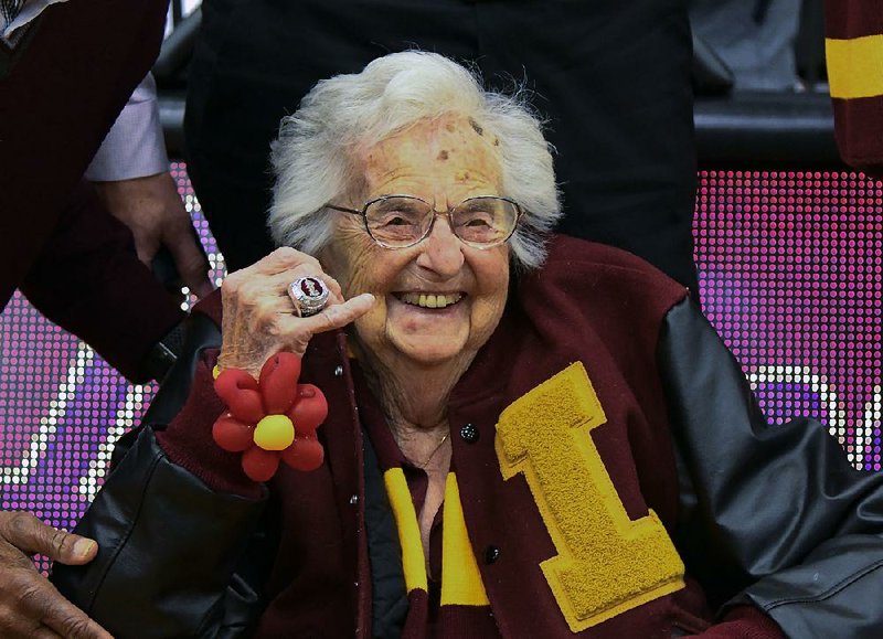 Sister Jean Dolores Schmidt poses for a picture with the Final Four ring she was given Tuesday night before Loyola-Chicago’s rematch against NCAA Tournament opponent Nevada. 