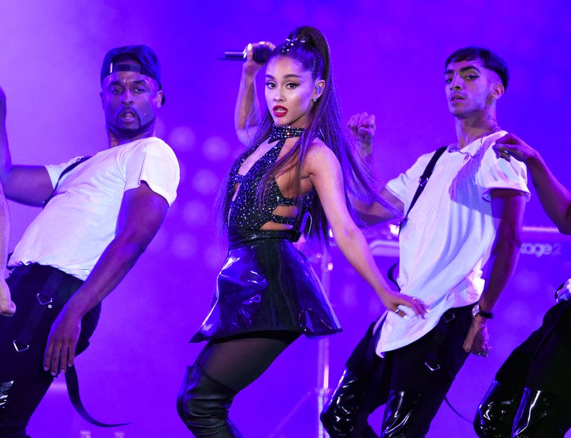 FILE - In this June 2, 2018 file photo, Ariana Grande, center, performs at Wango Tango in Los Angeles. Grande is giving fans an all-access pass into her musical life through a new documentary series on YouTube. 
The streaming service announced Wednesday, Nov. 28, that Grande will be featured in &#x201c;Ariana Grande: Dangerous Woman Diaries.&#x201d; (Photo by Chris Pizzello/Invision/AP, File)