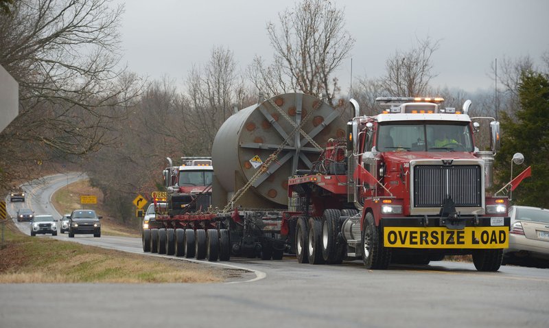 A pair of semi tractors makes their way Thursday, Nov. 29, 2018, up Arkansas 265 to Arkansas 170 near West Fork with the assistance of the Washington County Sheriff's Office. The truck was transporting a part of the long-decommissioned University of Arkansas SEFOR nuclear reactor to a site in Utah, with the entire vehicle being 18 feet wide and 115 feet long.