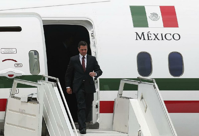 Mexico President Enrique Pena Nieto arrives Thursday in Buenos Aires, Argentina, for the Group of 20 summit, where he is expected to sign a revised trade pact with the United States and Canada.
