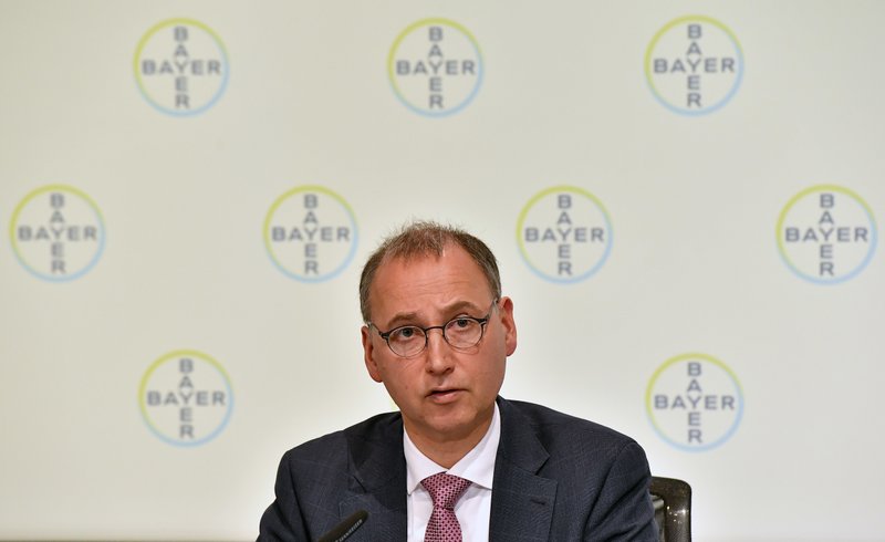 FILE - In this Feb. 28, 2018 fiel photo CEO Werner Baumann of Bayer AG talks to the media at the Financial News Conference in Leverkusen, Germany. Bayer said Thursday, Nov 29, 2018 it will cut 12 000 jobs, most of them in Germany. (AP Photo/Martin Meissner, file)