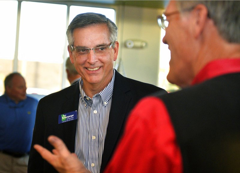 Republican Secretary of State candidate Brad Raffensperger greets supporters during a campaign stop in Augusta, Ga., Thursday, Nov. 29, 2018. Raffensperger and Democrat John Barrow are vying in a Dec. 4 runoff for Georgia secretary of state. (Michael Holahan/The Augusta Chronicle via AP)