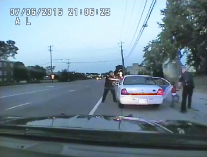 In this file image made July 6, 2016, from video captured by a camera in the squad car of St. Anthony Police officer Jeronimo Yanez, the Minnesota police officer, left, is shown after shooting into the vehicle at Philando Castile during a traffic stop in Falcon Heights, Minn., as the 4-year-old daughter of Castile's girlfriend, Diamond Reynolds, starts to get out of the car and is grabbed by an officer. The video was made public by the Minnesota Bureau of Criminal Apprehension and the Ramsey County Attorney's Office, Tuesday, June 20, 2017, just days after the officer was acquitted on all counts in the case. For the first time, the FBI will start tracking when police use force that leads to a death or serious injury. (St. Anthony Police Department via AP, File)