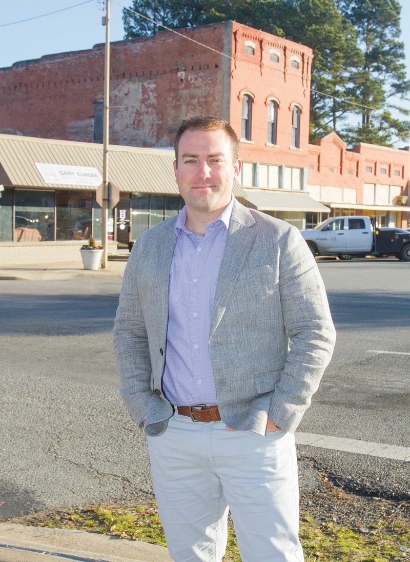 Trae Reed stands at the intersection of Center and Front streets in downtown Lonoke. Reed, 36, was elected Lonoke mayor during the Nov. 6 general election, defeating incumbent Wayne McGee, who has been mayor for 12 years. Reed, who is originally from Tennessee, is married to the former Ashley Emory, who graduated from Lonoke High School in 1996.