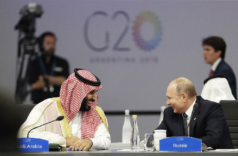 Saudi Crown Prince Mohammed bin Salman and Russian President Vladimir Putin talk and laugh Friday as the Group of 20 summit kicks off Friday in Buenos Aires, Argentina.