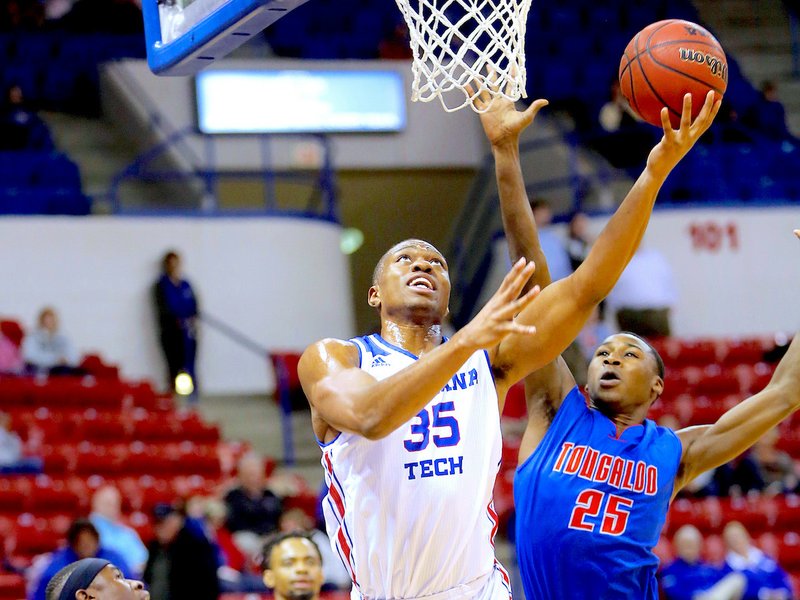 Submitted photo POWER FORWARD: Louisiana Tech junior forward Oliver Powell (35) lays the ball in against Tougaloo College sophomore Datavian Porter (25) during the Bulldogs' 87-68 home win on Nov. 20 inside the Thomas Assembly Center on Karl Malone Court. Photo by Darrell James, courtesy of Louisiana Tech Communications.