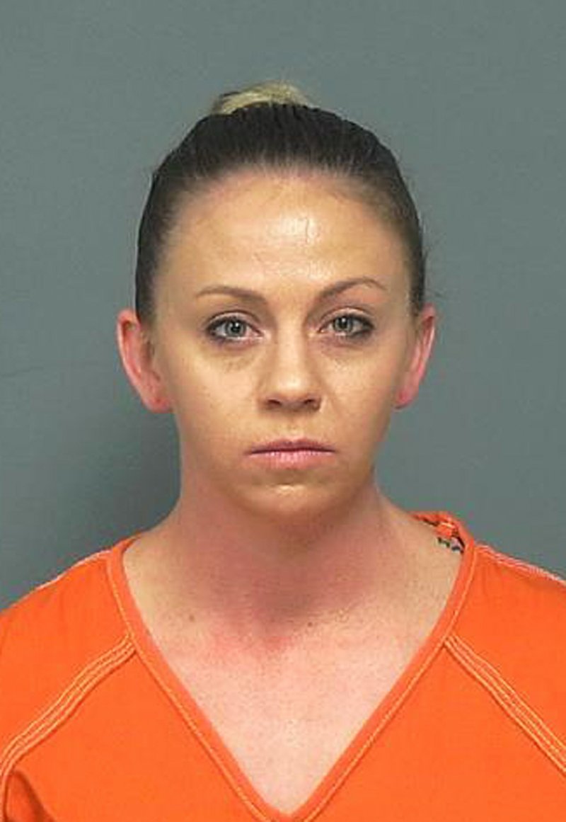 This undated photo provided by the Mesquite Police Department shows Amber Guyger. Former Dallas police officer Guyger was indicted on murder charges Friday, Nov. 30, 2018, nearly three months after she fatally shot an unarmed black neighbor whose apartment she said she entered by mistake, believing it to be her own. (Mesquite Police Department via AP)